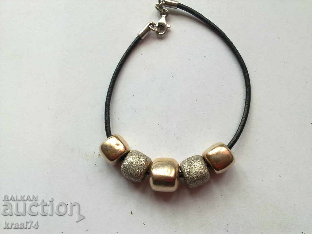 Silver bracelet with gold