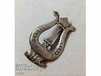 I AM SELLING A ROYAL BADGE MILITARY WIND MUSIC - CAPE MASTER