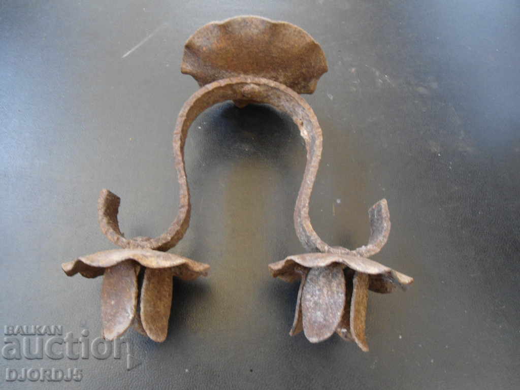 Delivery of An old forged candlestick Delivery of An old forged candlestick