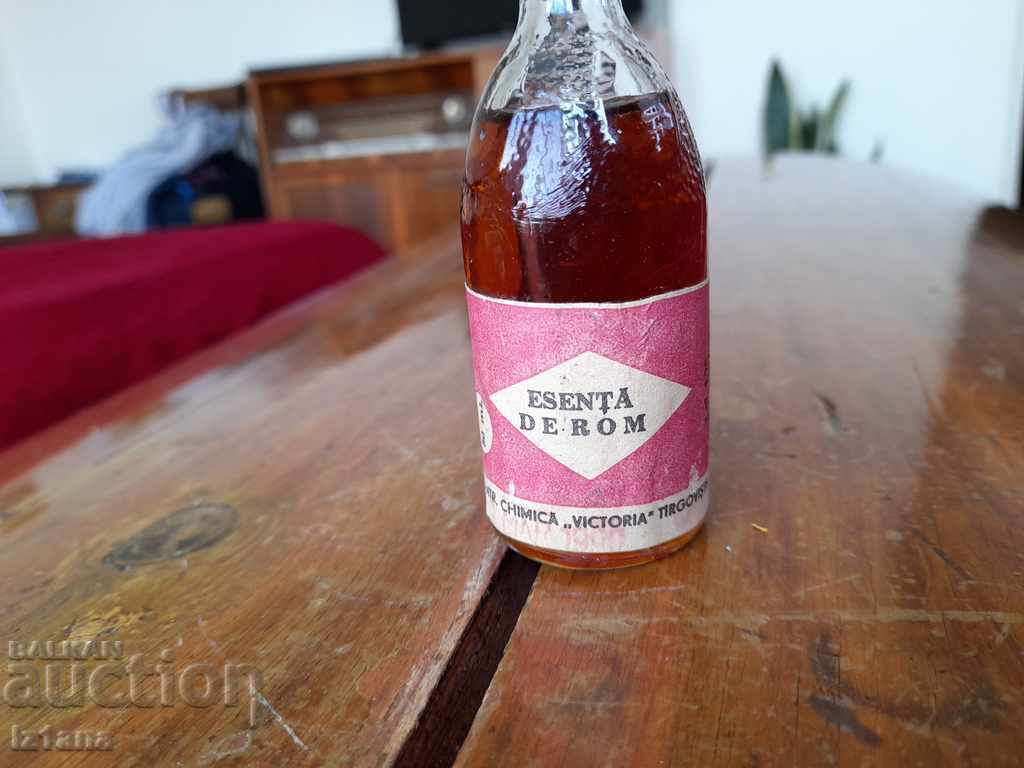 Auction  Old bottle of rum essence