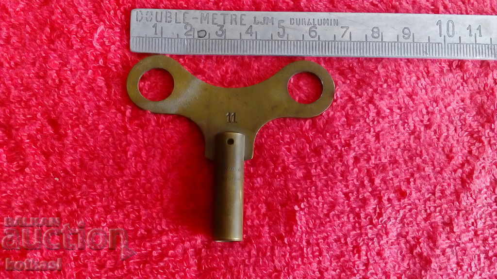 Old wall clock key
