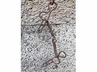 Old forged bridle reins wrought iron, harness