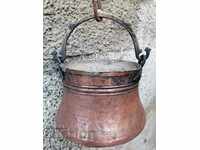 An old copper kettle, a bakery, a boiler, a forged vessel