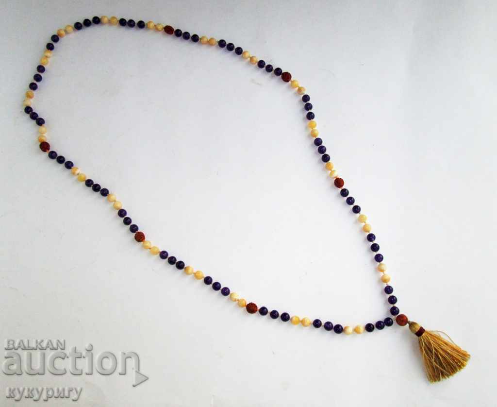 Old long rosary necklace string with stones and nuts