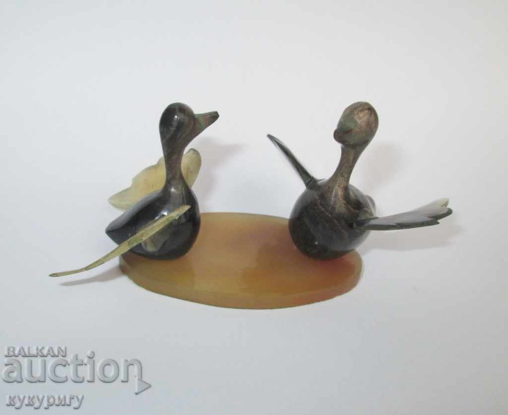 Old statuette figure ducks handmade from horn