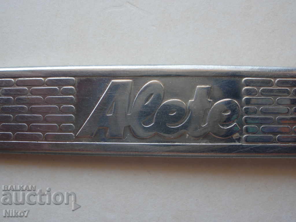Auction  Metal bottle opener "Alete"