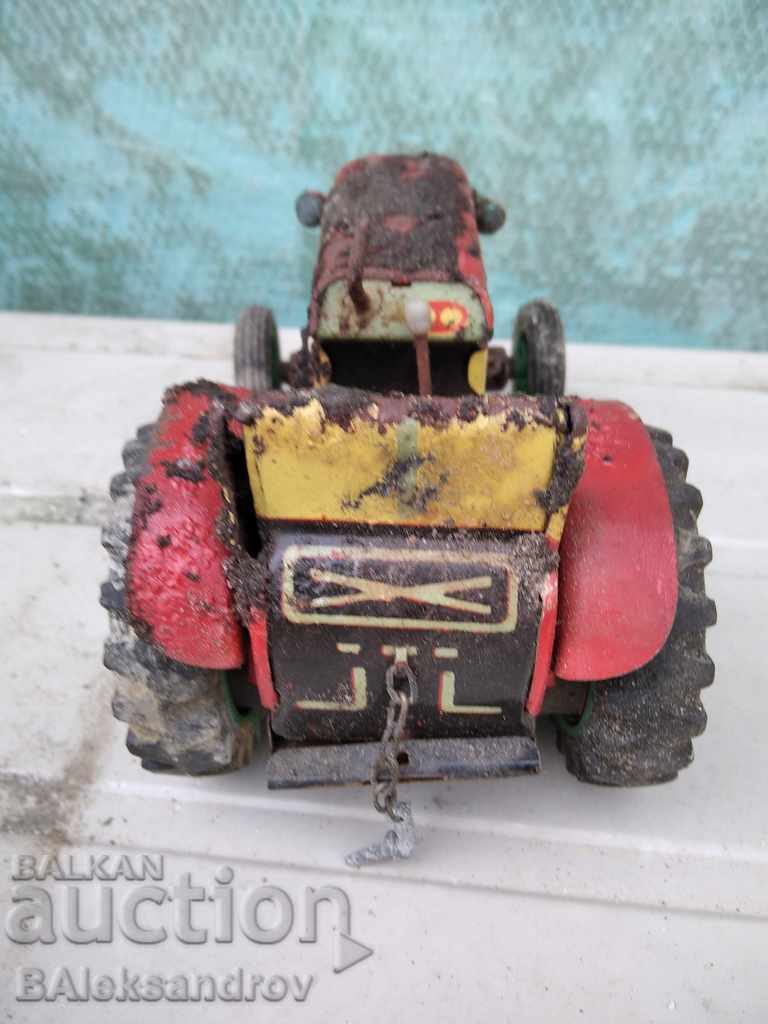 Delivery of An old uncleaned tin toy