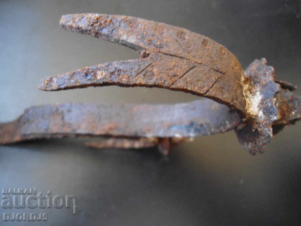 Auction An old forged candlestick Auction An old forged candlestick