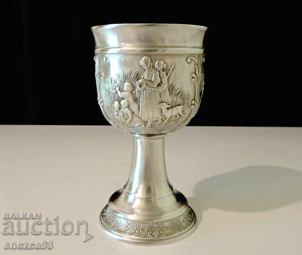 Pewter goblet, wine glass made of pewter with beautiful rural scenes Pewter goblet, wine glass made of pewter with beautiful rural scenes