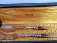 Old French utensils for serving salad in a box