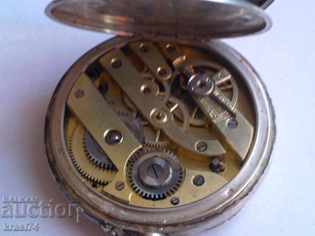 Auction Silver pocket watch with gilt Auction Silver pocket watch with gilt