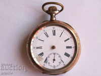 Silver pocket watch with gilt