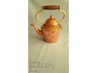 Bronze teapot with brass handle