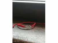 New silver bracelet with red thread