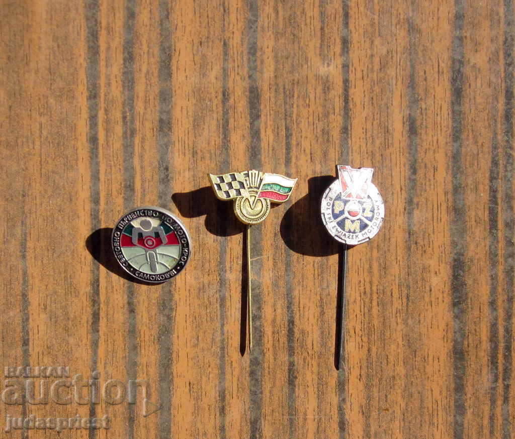 Lot of old motor racing badges, motorcycle signs, motocross signs