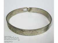 Old womens bracelet hand forged with flower decoration