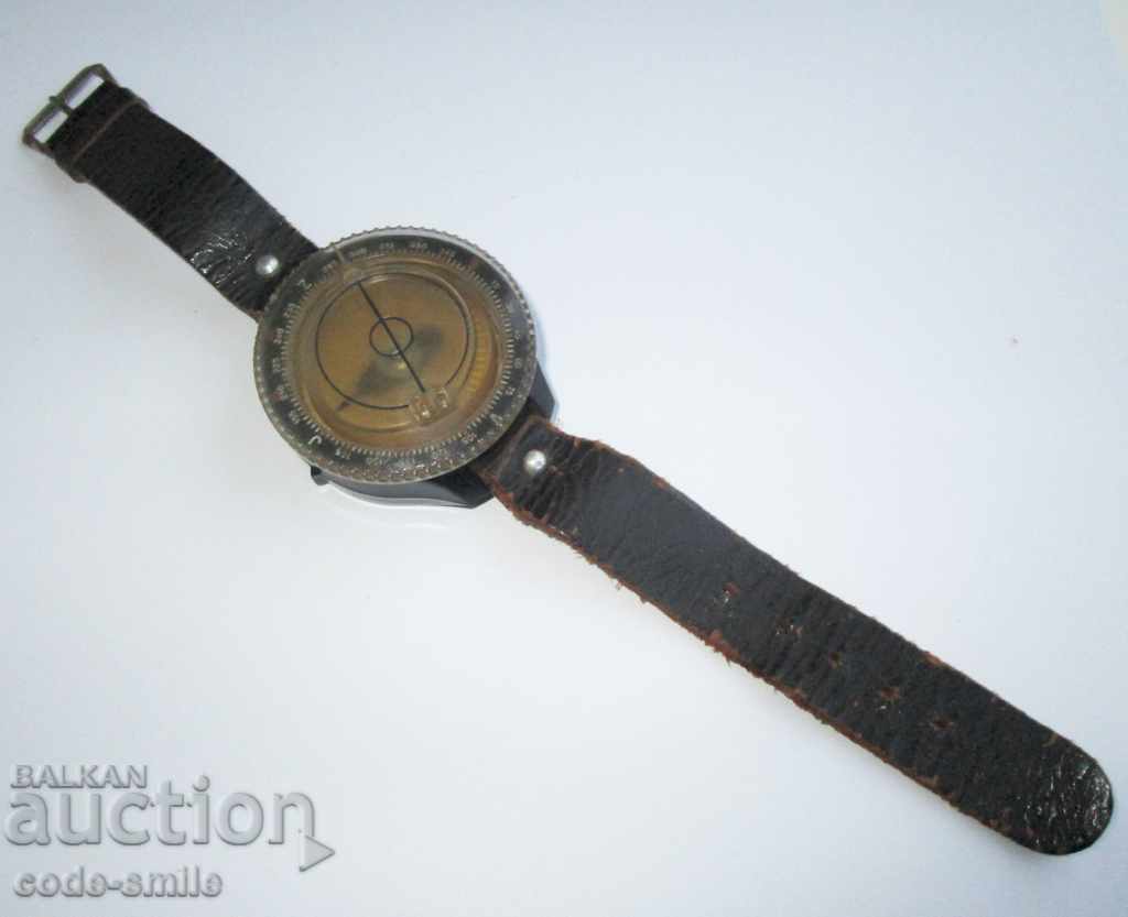 Old military hand compass with World War II fluid