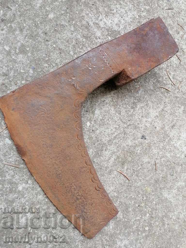 Old ax with engraved ax tool wrought iron