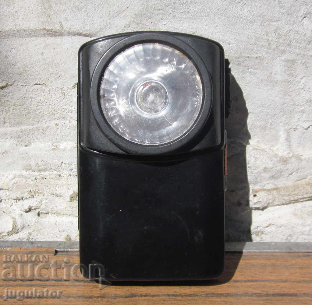 old metal flashlight lantern