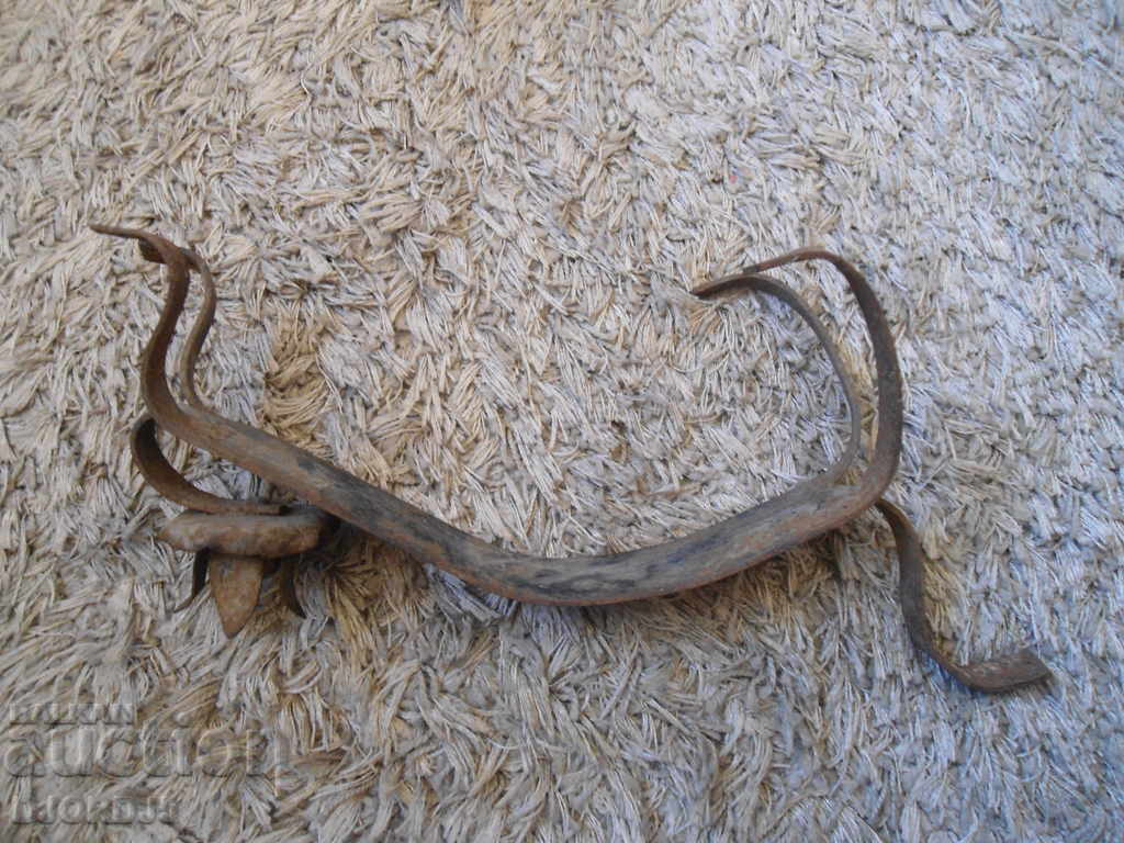 Auction An old forged candlestick Auction An old forged candlestick