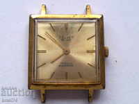 Позлатен часовник Полет де Лукс