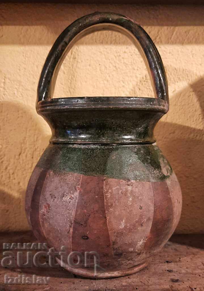 Old green glazed ceramic pot