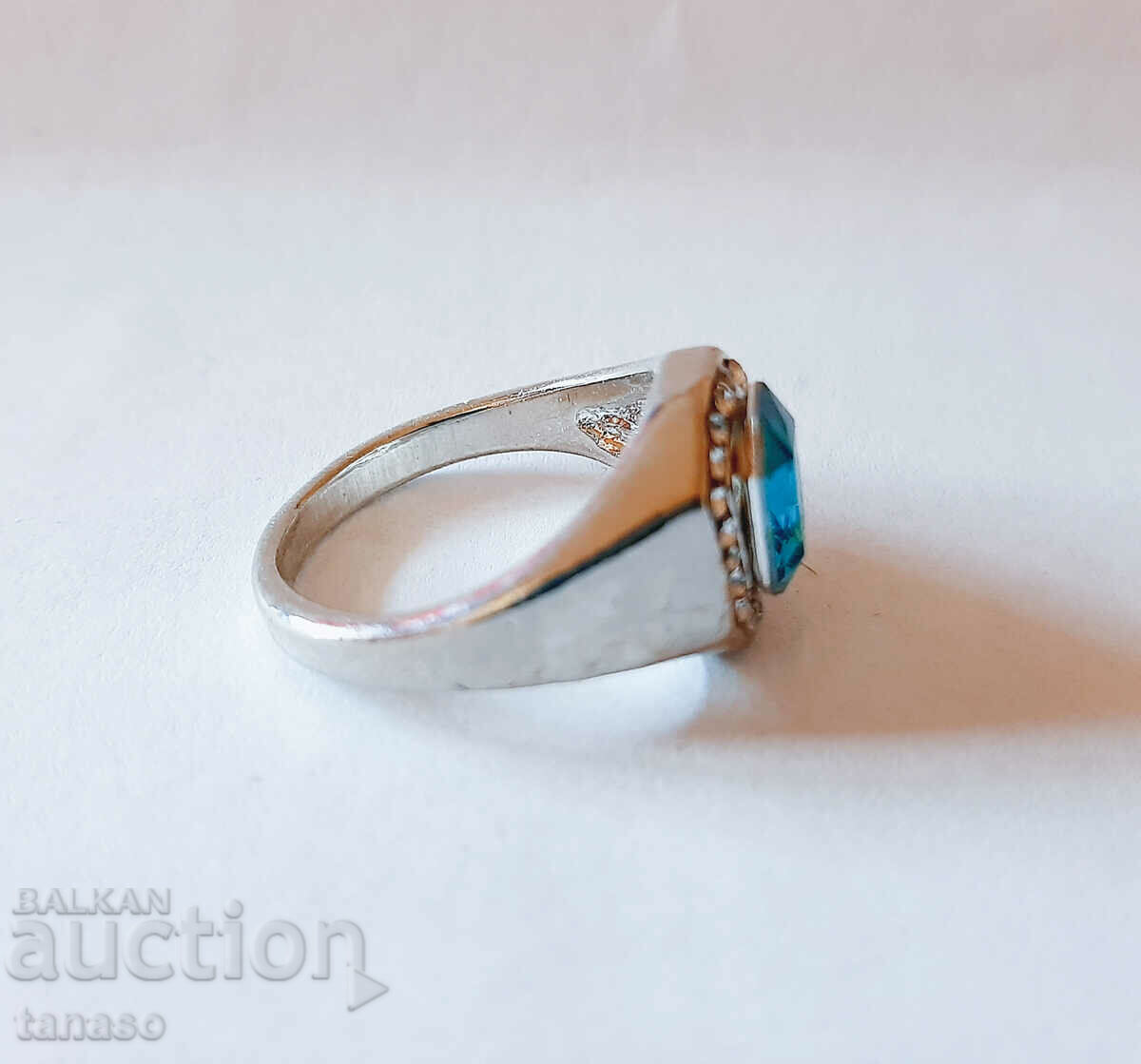 Auction  Men's ring with blue zircon and topaz