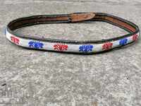 An old hand-knotted belt with a purple sands belt belt costume