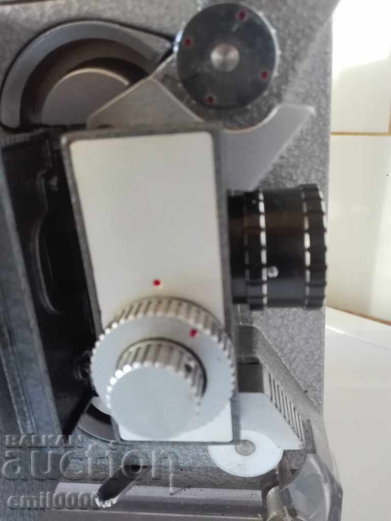 Auction  An old German movie machine.