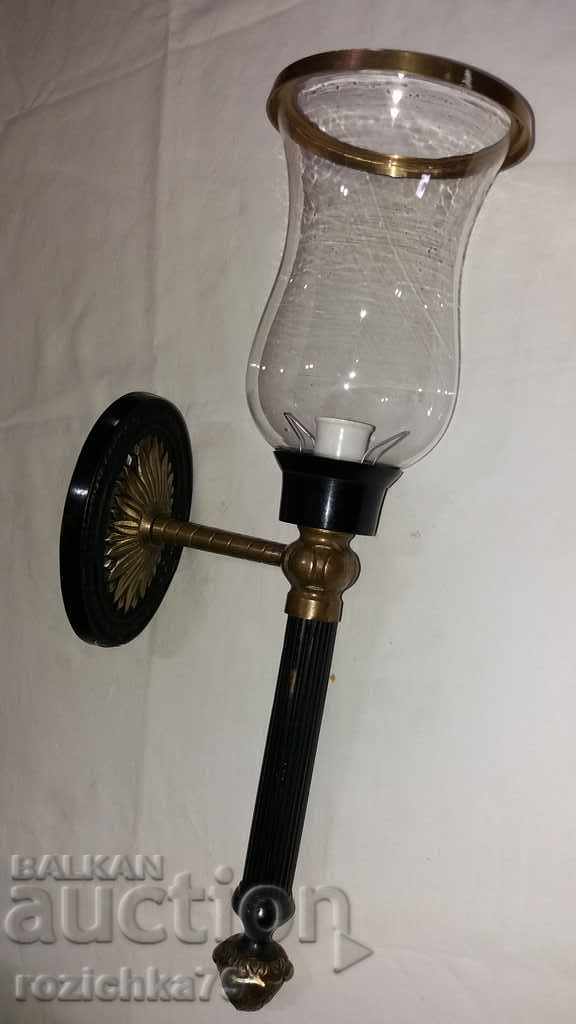 Old bronze wall sconce with fine glass