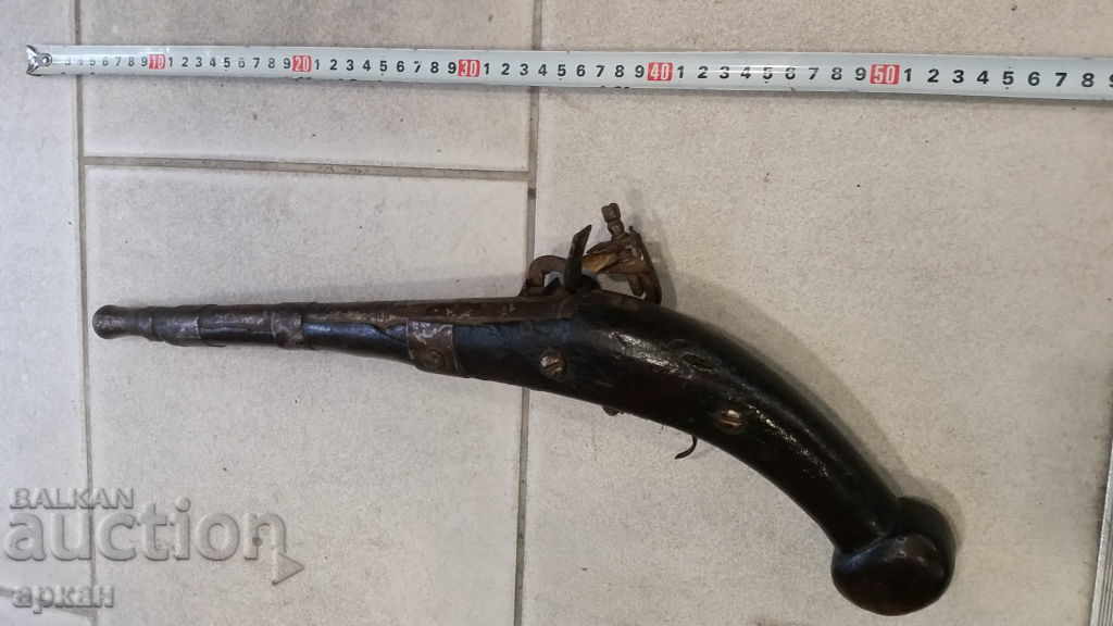 Delivery of Old flintlock pistol
