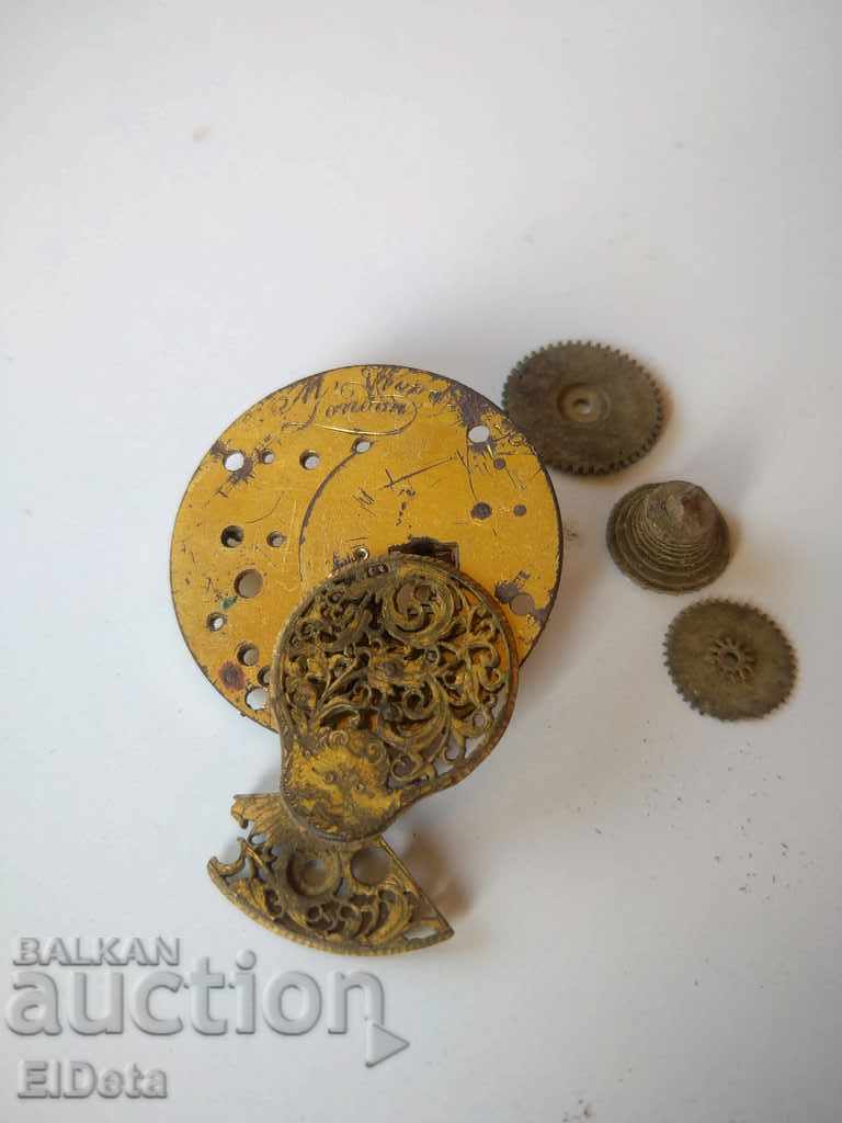 Auction Gold-plated parts of a watch Auction Gold-plated parts of a watch