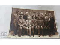 Φωτογραφία Ομάδα ανδρών με κοστούμια