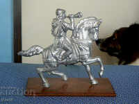 Old metal Russian figurine. Horseman.