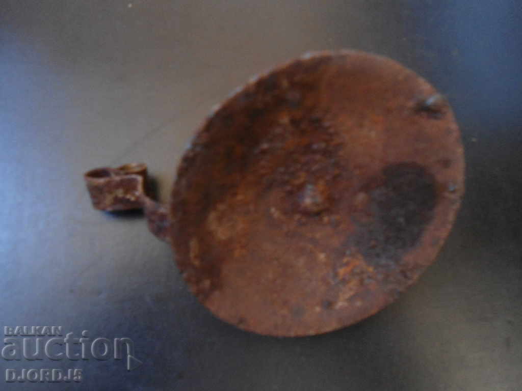 Delivery of An old forged candlestick