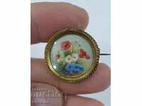 Hand-painted old gilded brooch of the early 20th century