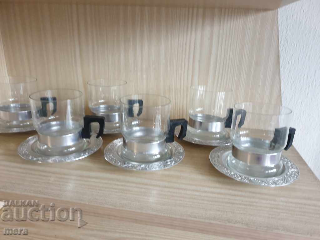 Delivery of Retro tea cups made of yen glass with metal pads Delivery of Retro tea cups made of yen glass with metal pads
