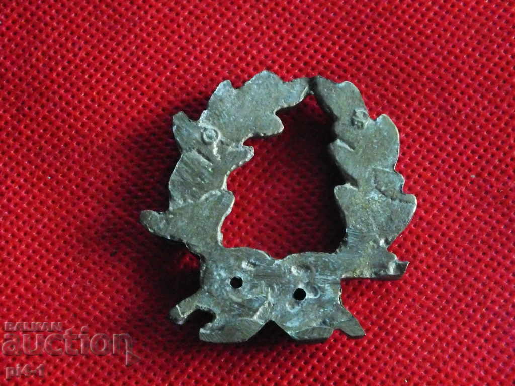 Auction Bronze wreath sign Auction Bronze wreath sign