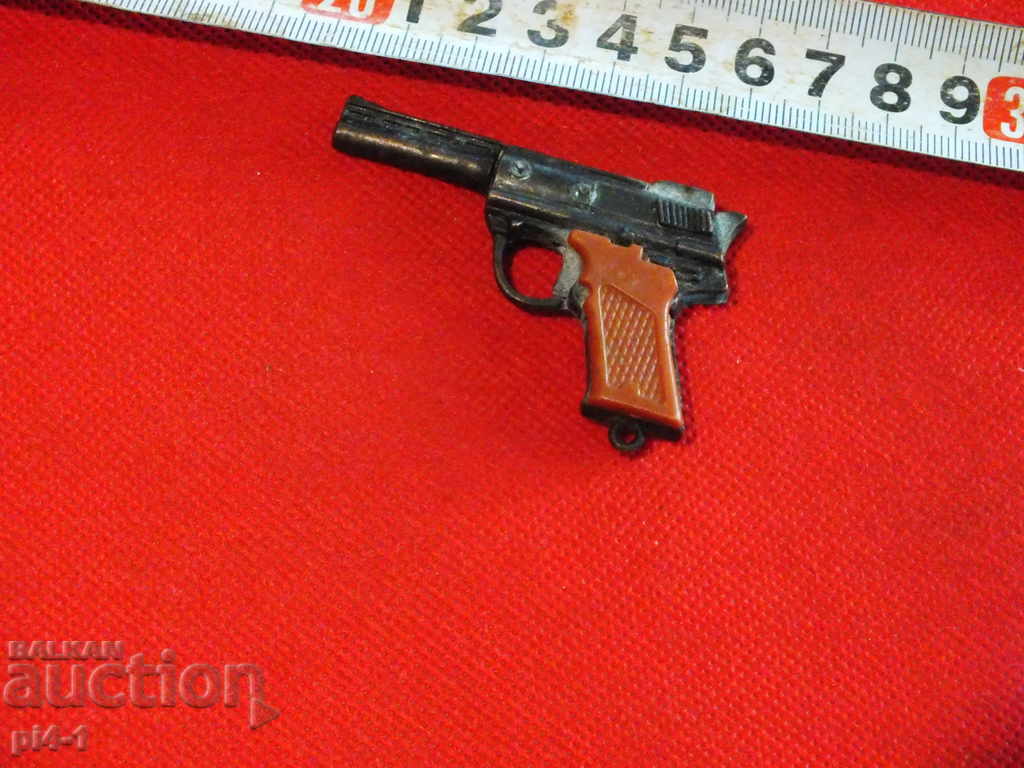 Auction Pistol with eyelets - metal Auction Pistol with eyelets - metal