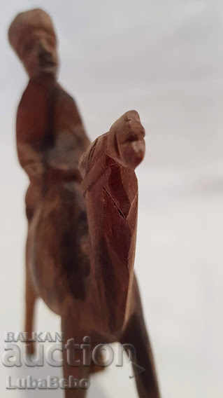 Hand-carved wooden figure of a camel with a rider. with price 25.00 BGN | € 12.78 Hand-carved wooden figure of a camel with a rider. with price 25.00 BGN | € 12.78