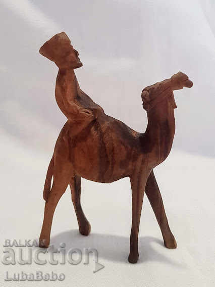Hand-carved wooden figure of a camel with a rider. - 6 Hand-carved wooden figure of a camel with a rider. - 6