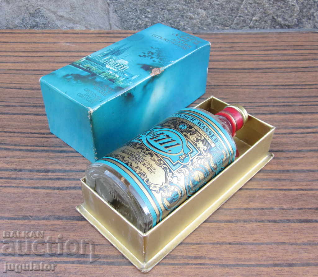 Auction an old German glass bottle of cologne with a box Auction an old German glass bottle of cologne with a box