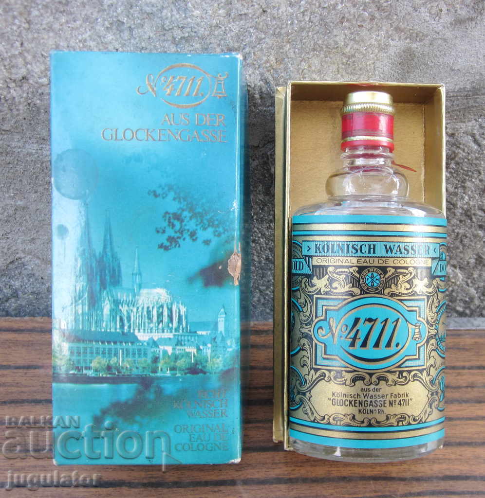 an old German glass bottle of cologne with a box