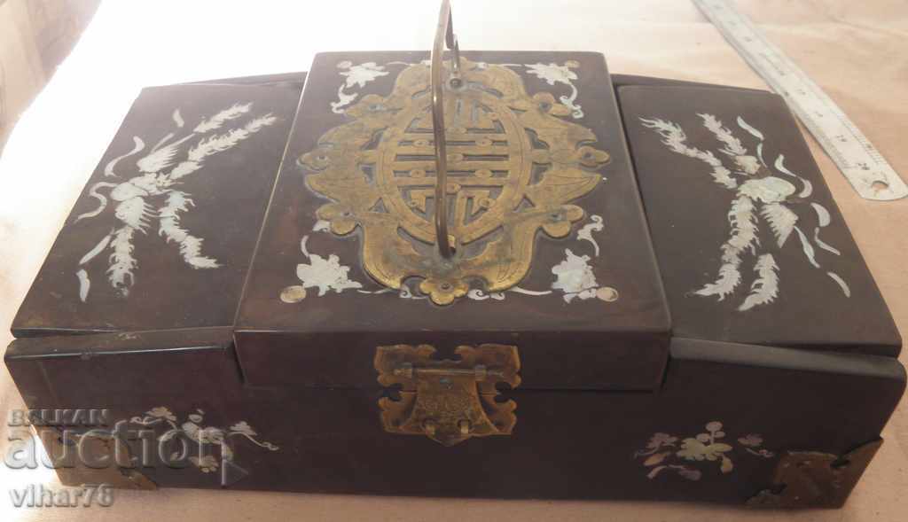 Old wooden box with hardware and mother of pearl
