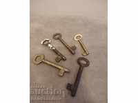 Lot of four brass keys and one no