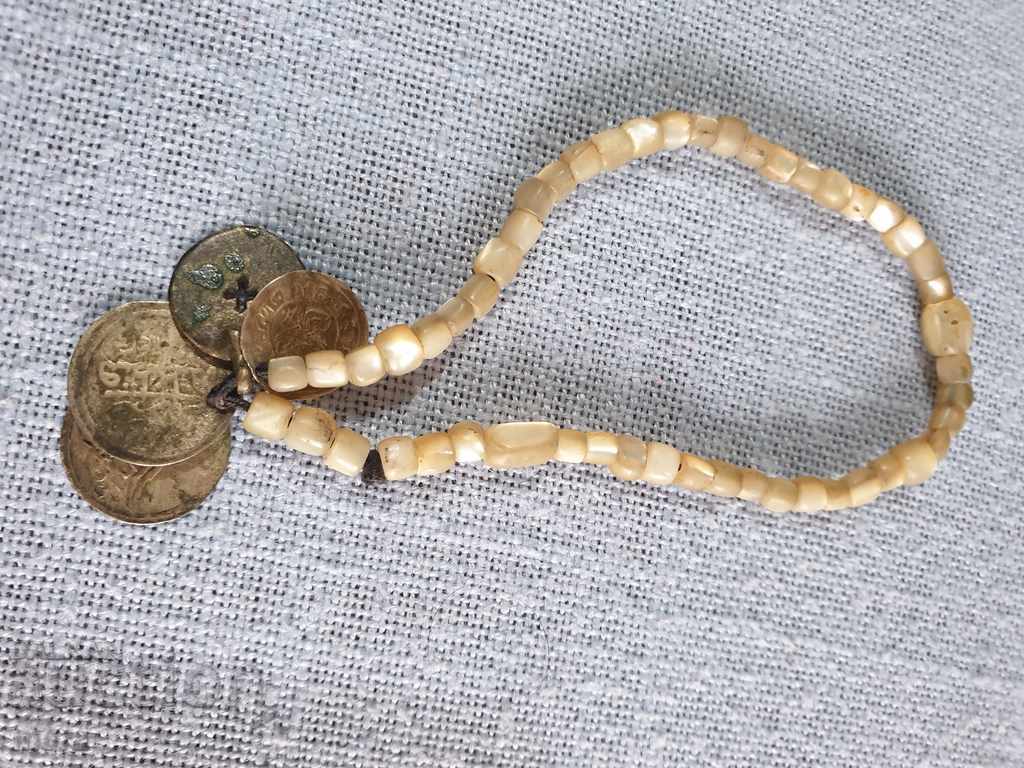 Auction Pearl bracelet with 4 silver coins Auction Pearl bracelet with 4 silver coins