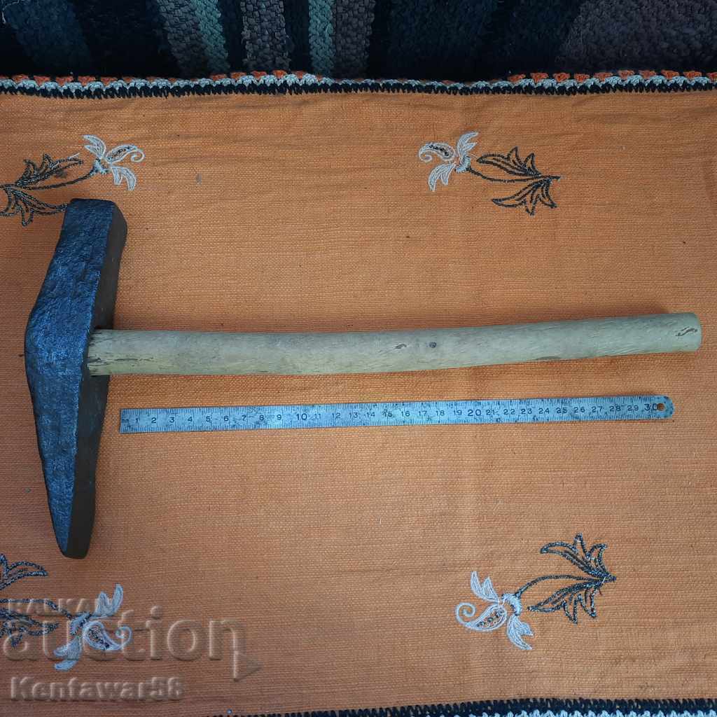 Antique wrought stone stone hammer. Antique wrought stone stone hammer.