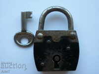 Old padlock with key.