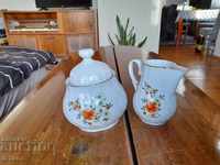 Old set of porcelain sugar bowl and jug
