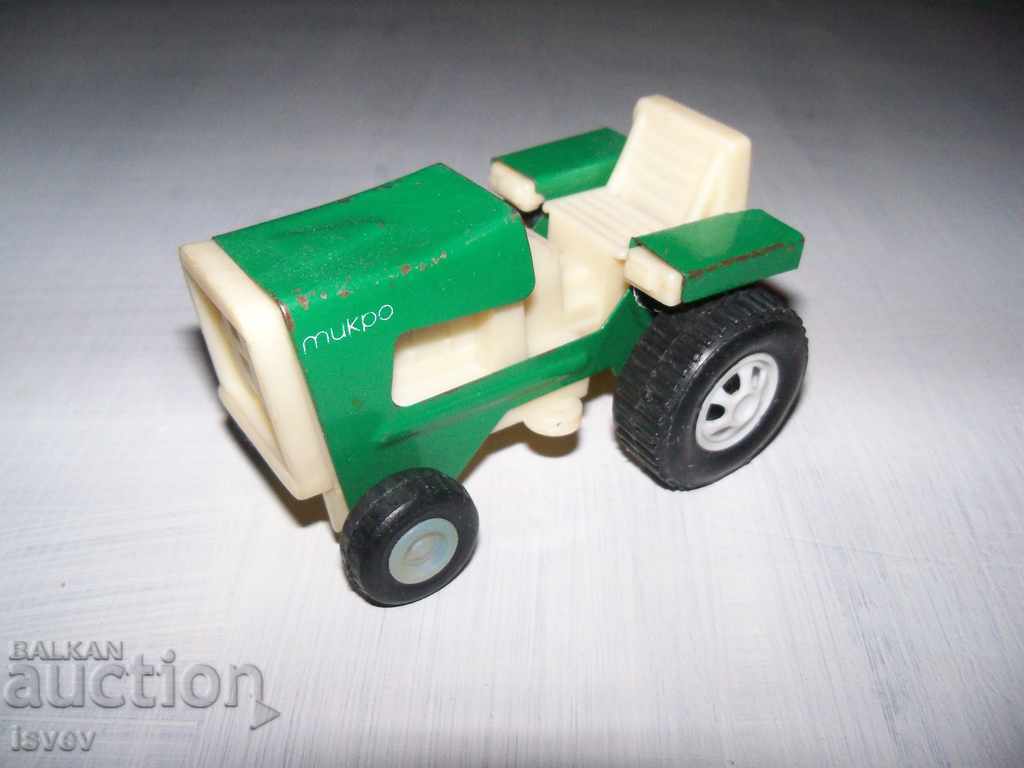Old tin tractor, social toy
